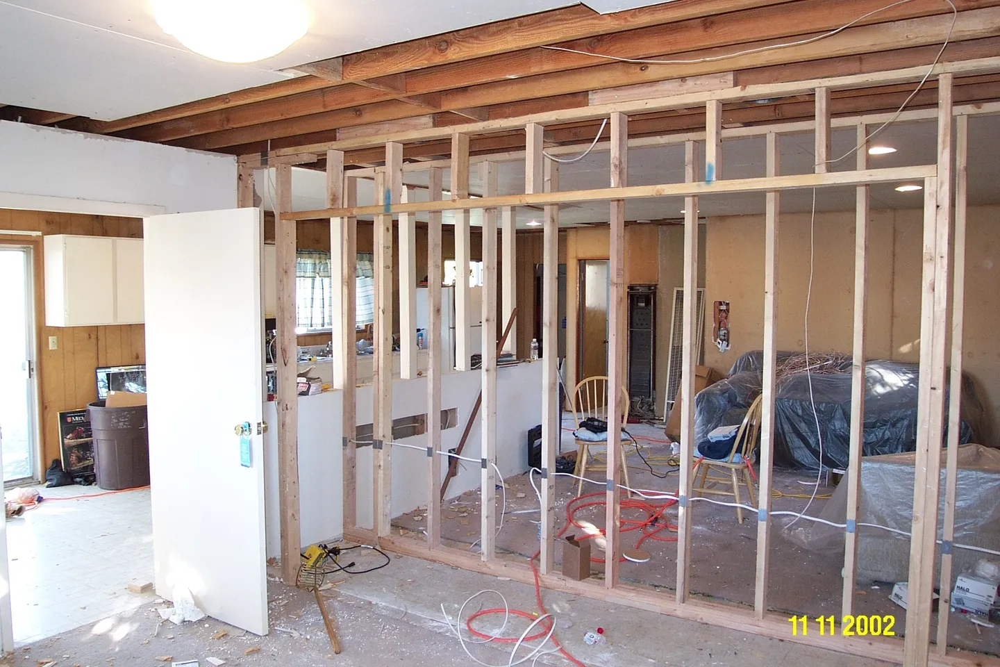 A room being remodeled with some wood framing.